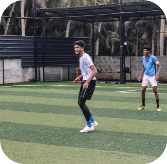 Players playing football at sports academy event