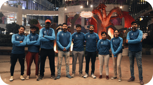 Players playing football at sports academy event