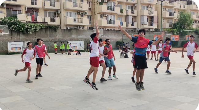 Players playing football at sports academy event